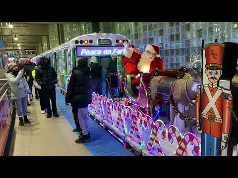 CTA Santa Train Blue Line waiting for the other CTA train to pull out of O’hare Airport
