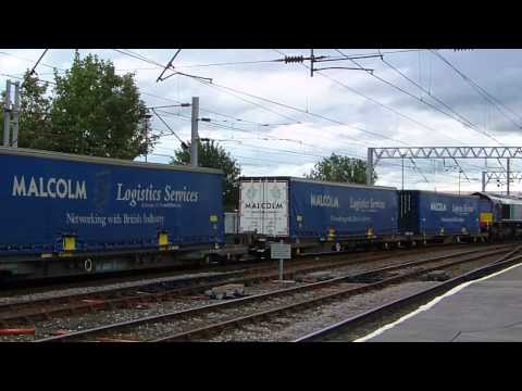 DRS 66423 departs Carlisle with Asda and Malcolm Logistics containers