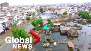 Pakistan floods: Drone footage captures submerged city as rains leave at least 900 dead