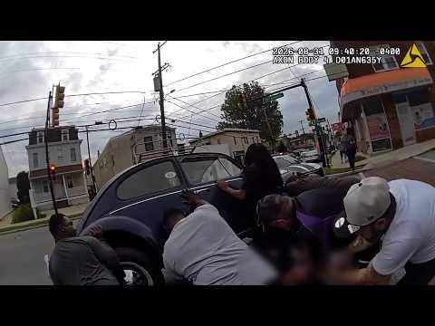 Nine Strangers All Help Lift A Car Off An E-Bike Rider