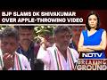 DK Shivakumar S Apple Throwing Video Sparks Political Row BJP Launches Sharp Attack
