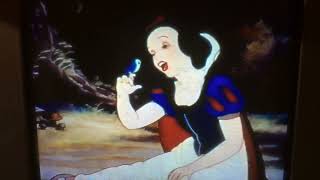 Snow White and the seven dwarfs with a smile and a song