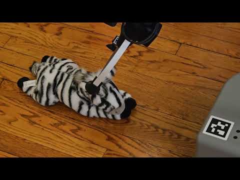 Pick up the stuffed toy zebra