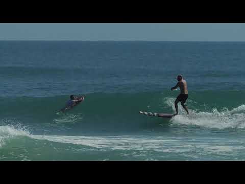 Solid swell rolls in to Ponce Inlet for fun surfing