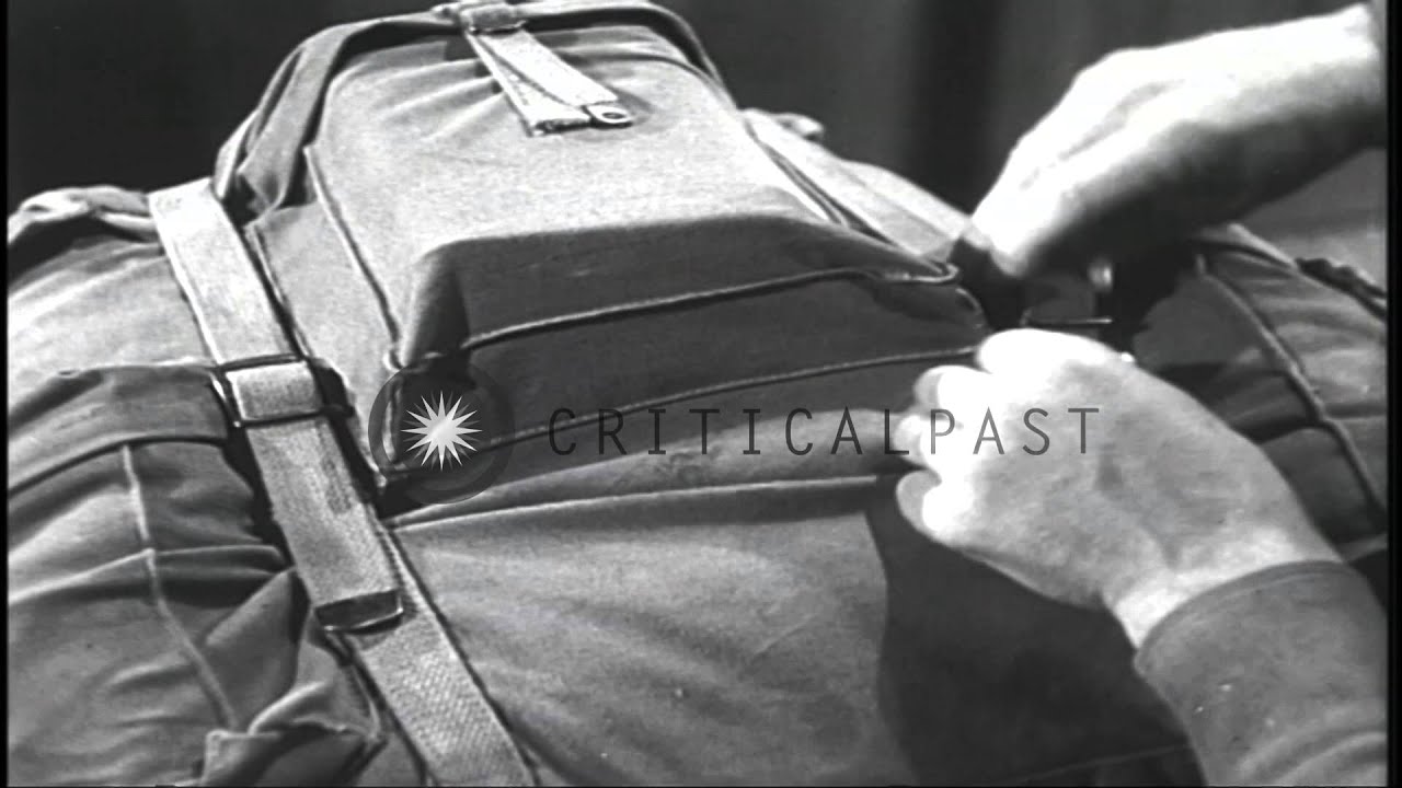 Miniature de la vidéo A ski trooper wears a rucksack and adjusts its straps in an equipment room in the...HD Stock Footage du film Ski Equipment