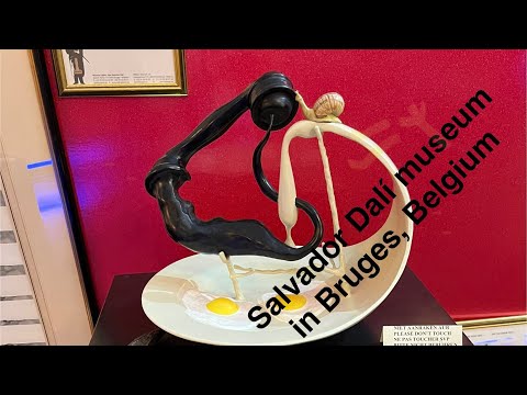 Salvador Dalí museum in Bruges, Belgium. The review on the art exposition. Belfry tower,Grand market