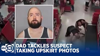 Dad tackles man suspected of taking upskirt photos