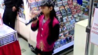 A Young Talented Girl Singing at a Mall. Spectacular!
