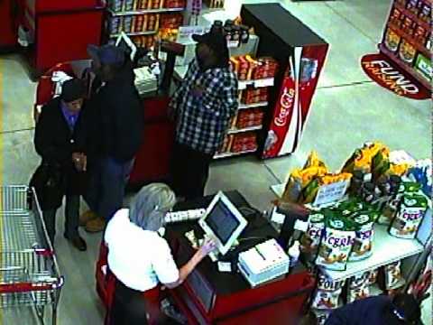Theft suspects at the cash register.