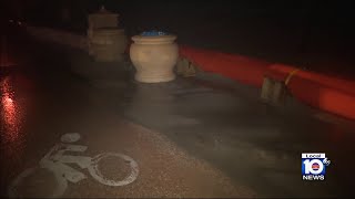 Water, sand cross Hollywood Beach barriers by nightfall during tropical storm-like weather