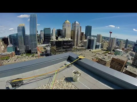 Post-construction rope access high-rise window cleaning with rigging