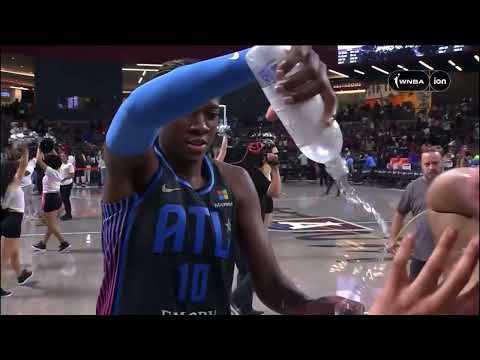 Rhyne Howard douses Allisha Gray during postgame sideline interview