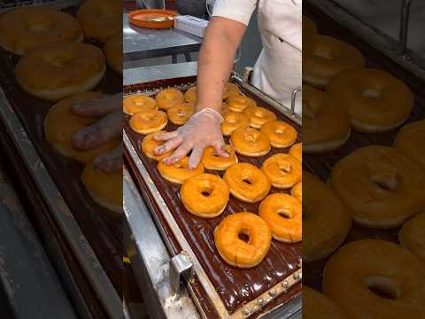 FRESH CHOCOLATE DONUTS with sprinkles.