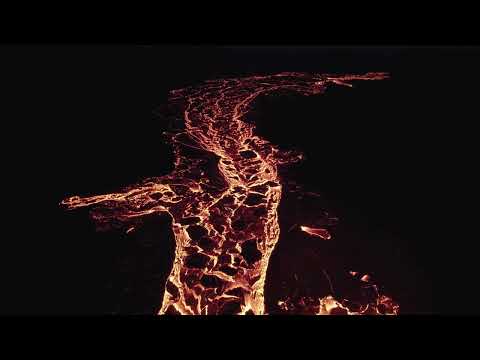 VideoVault Stock Video: Lava with chunks of rock flows down the hill