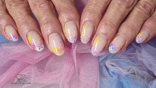Fixing a broken nail during gel rebalance to match natural nails. Rainbow ombre spring flowers nails
