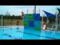 Nick Climbing The Rock Wall Out Of The Pool