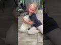 Little Girl Kissing And Hugging A Puppy