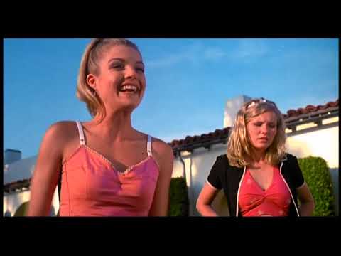 Bring It On (2000) official trailer frame — Toros cheer squad mid-stunt in a packed gym