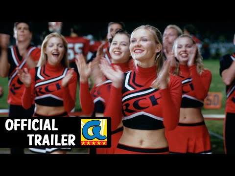 Trailer frame — the Clovers lock into choreography at a pep rally