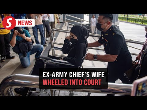 Ex-Army chief's wife gets wheelchair assistance upon arrival at court
