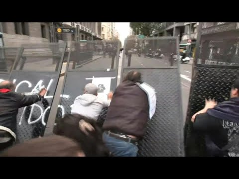 Protesters knock down barricade, clash with police amid Argentina pension debate | AFP