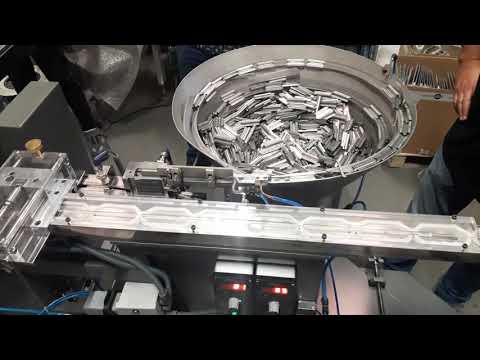 HIGH SPEED FULLY AUTOMATIC SPOT WELDING, HOLE PUNCHING & FLANGING MACHINE