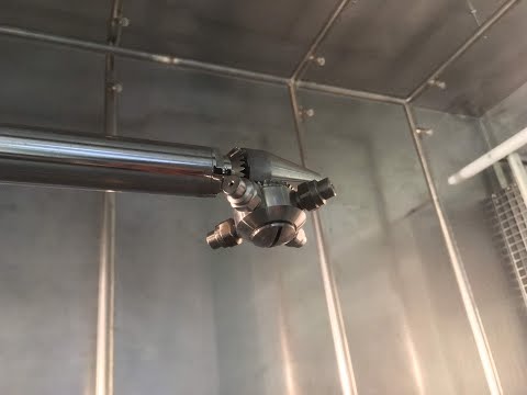 High pressure cleaning head operating inside a CMS automatic IBC washing station