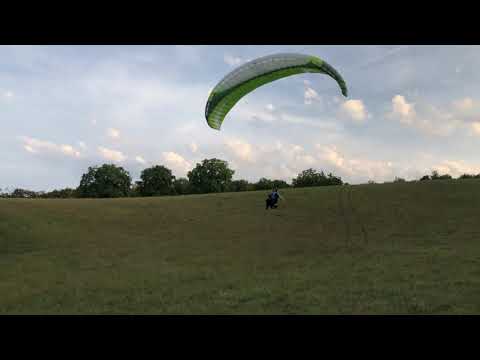 Paraglider practice at training slope