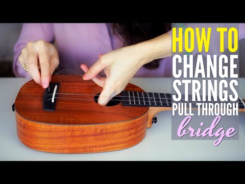 HOW TO change ukulele strings on a pull through bridge (Enya Ukulele)