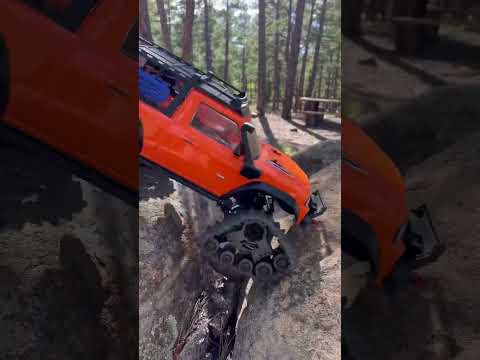 Traxxas TRX4 sport with tank tires in the forest