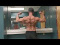 Superman posing/flexing bodybuilding men's physique post back training