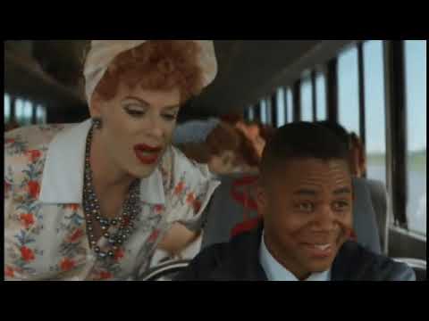 Trailer montage — split-screen racers, spinning tires, and a hard cut to concert lights for the finale song