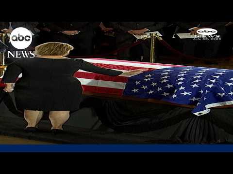 Sen. Darline Graham touches the casket of late brother Lindsey Graham