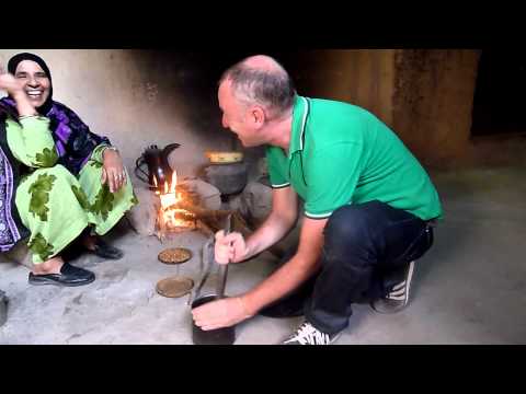 Pounding the coffee beans in Al-Hamra