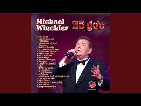 På et tæppe nær ved stranden