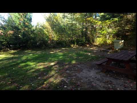 Horseshoe pit, picnic tables near entrance to tent area