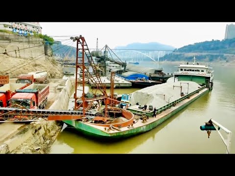 The first working day starts the new year 2023 !  Barge unloading cobblestone