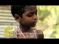 Indian Woman Bathes Her Child In An Open Place Before School