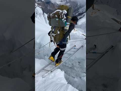 Crossing the ladder between Manaslu camp-1 & 2 Mr- @Saila_mingma