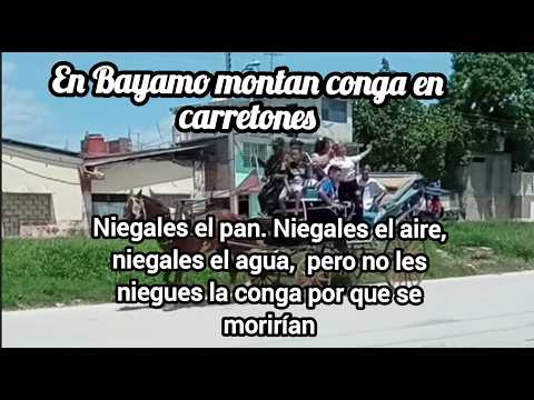 PESE A CRISIS EN BAYAMO, CUBA,  GOZAN PASEANDO UNA CONGA EN CARRETONES