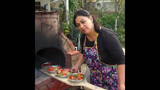 Popular Turkish Street Fast Food Tepsi Kebab with cheese and vegetables in the oven Village