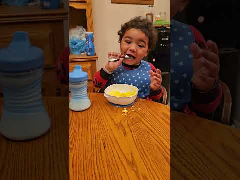 Jace eating scrambled eggs for breakfast. 