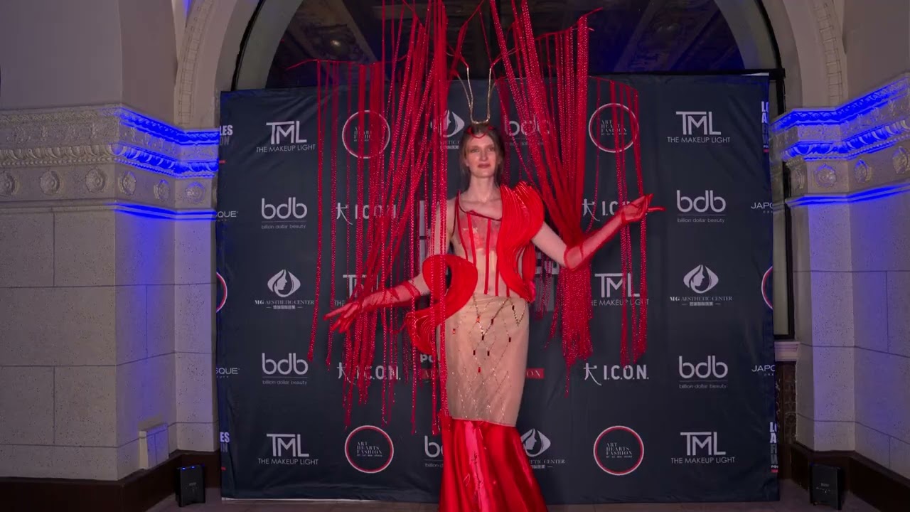 Ava Cherlyn poses with Model Kiki wearing unusual artistic dress at ArtHeartsFashion LAFW