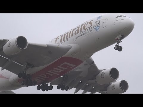 A380 Emirates Appears from low clouds and fog  @ AMS Schiphol