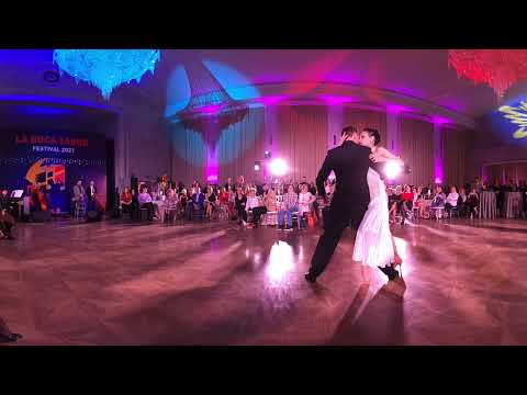  Dmitry Vasin  and  Sagdiana Hamzina  are  dancing  to  the  tango  "  Los Mareados  "  by  Solo Tango Orquesta  at  La Boca Tango Festival  in  2021