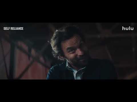 Official Hulu trailer frame for Self Reliance with Jake Johnson looking anxious in a car mirror