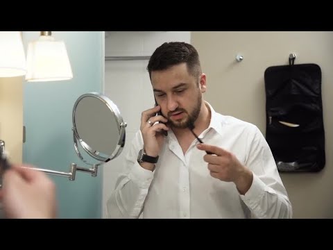 Businessman Multi-tasking In Bathroom Stock Video