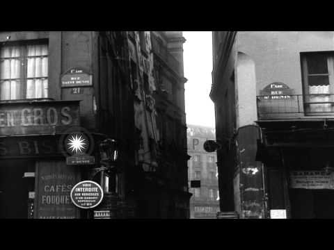 People walk through a narrow street surrounded with old buildings in a slum area ...HD Stock Footage