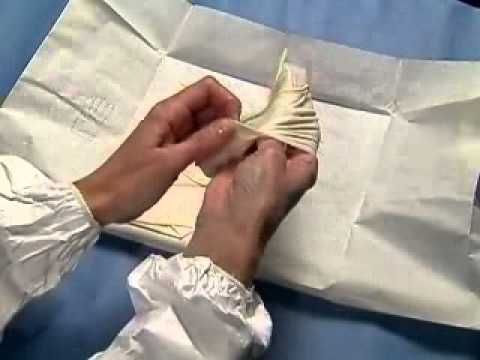 Technique for putting on surgical gloves