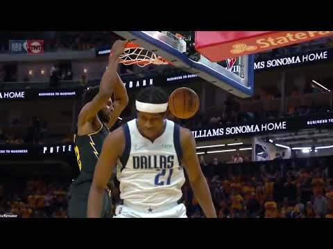 Frank Ntilikina makes an executive business decision in mid-air during Andrew Wiggins jam